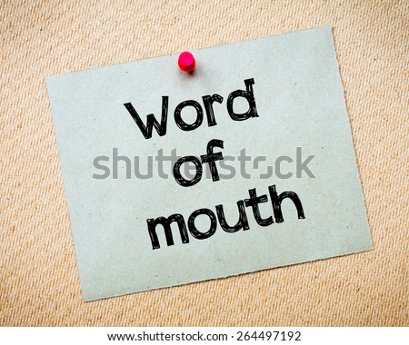 Word of mouth Message. Recycled paper note pinned on cork board. Concept Image