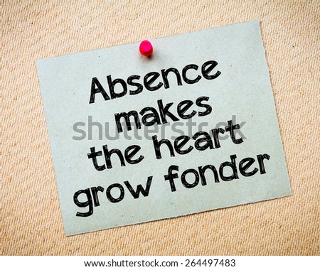 Absence makes the heart grow fonder Message. Recycled paper note pinned on cork board. Concept Image