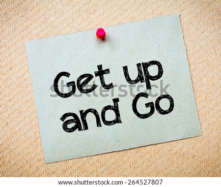 Get up and Go Message. Recycled paper note pinned on cork board. Concept Image