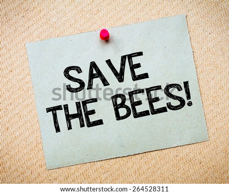 Save the bees Message. Recycled paper note pinned on cork board. Concept Image