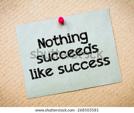 Nothing succeeds like success Message. Recycled paper note pinned on cork board. Concept Image