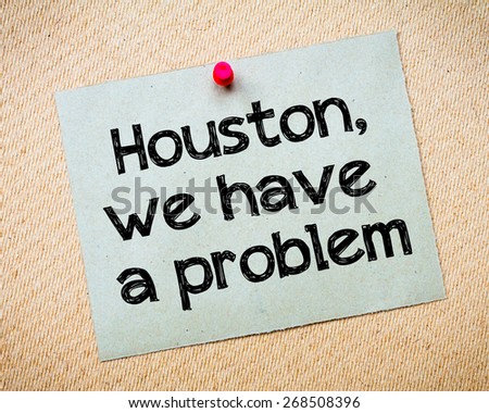 Houston, We Have a Problem Message. Recycled paper note pinned on cork board. Concept Image