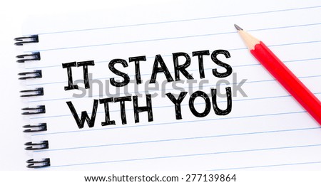 It Starts with You Text written on notebook page, red pencil on the right. Concept image