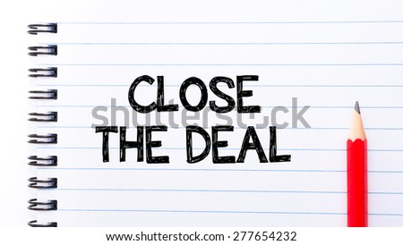 Close the Deal Text written on notebook page, red pencil on the right. Motivational Concept image