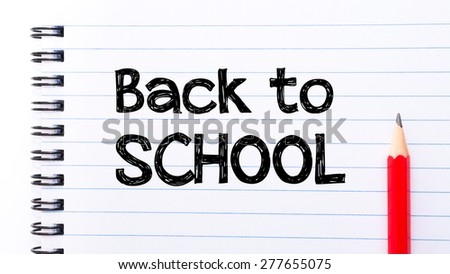 Back to School Text written on notebook page, red pencil on the right. Motivational Concept image