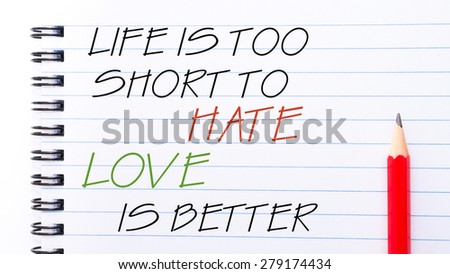 Life  is Too Short To Hate Love is Better Text written on notebook page, red pencil on the right. Motivational Concept image