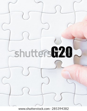 Last puzzle piece with word G20 SUMMIT. Concept image