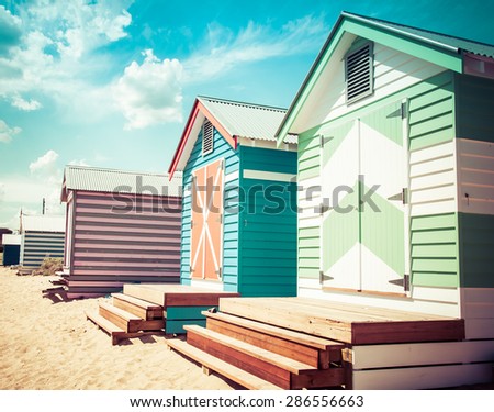 Bathing houses at Brighton Beach, Australia. View of colorful beach huts with retro color filter applied, summer vacation concept