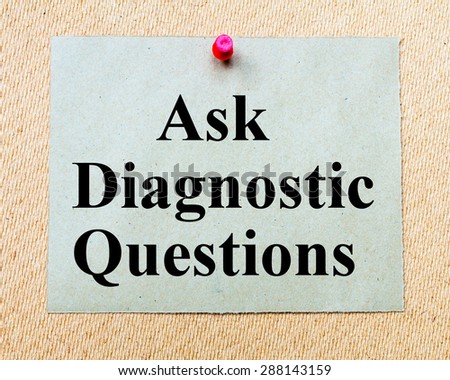 Ask Diagnostic Questions written on paper note pinned with red thumbtack on wooden board. Business conceptual Image