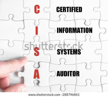 Hand of a business man completing the puzzle with the last missing piece.Concept image of Business Acronym CISA as Certified Information Systems Auditor