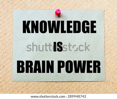 Knowledge Is Brain Power written on paper note pinned with red thumbtack on wooden board. Motivation conceptual Image