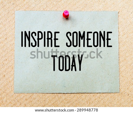 Inspire Someone Today  written on paper note pinned with red thumbtack on wooden board. Motivation conceptual Image