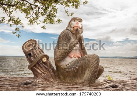 at the sea stay an statue monkey