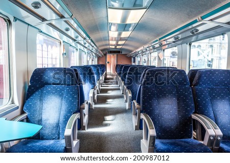 first class train carriage with blue seats