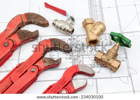 Plumbing Tools Arranged On House Plans whit wrench and water valves