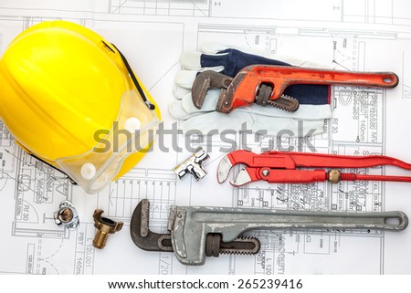Plumbing Tools Arranged On House Plans whit wrench
