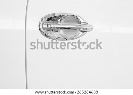 an car door in white with a chrome door handle