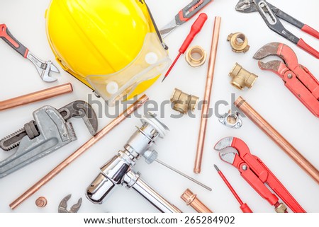 Plumbing Tools Arranged On white paper whit wrench