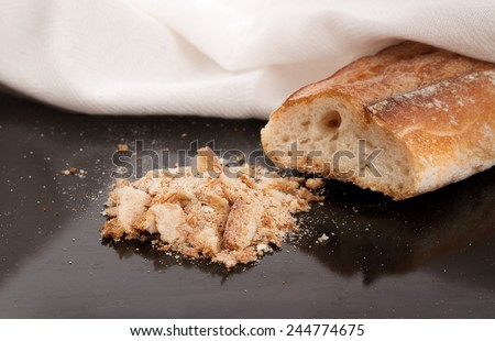 bread crumbs and dry bread on kitchen table
