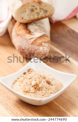 bread crumbs on wooden table