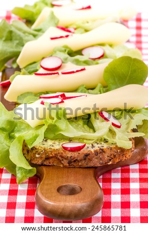 sandwiches on wooden board