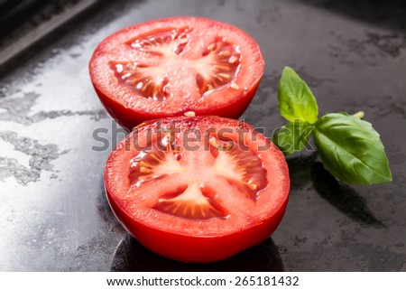sliced tomatoes with basil leave