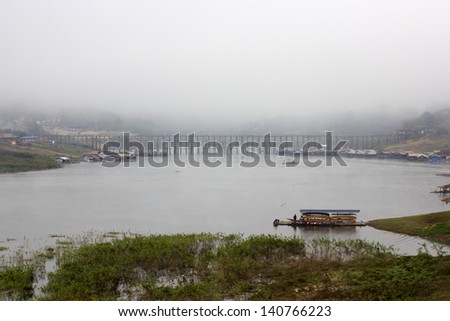 wood bridge in fog city
