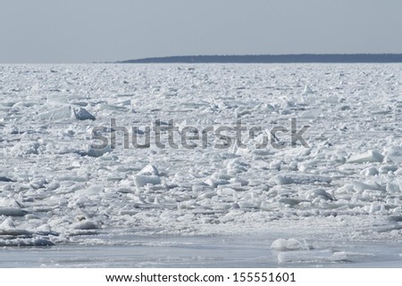 Sea covered with broken ice. Front focus.