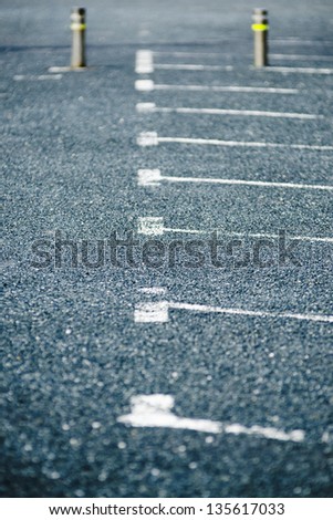 row of empty parking spaces outside, background