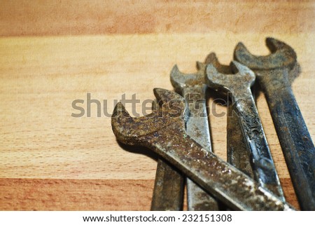 Some spanners on wooden background, studio shot.
