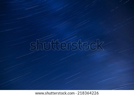 Beautiful sky at night with star trails. Earth\'s rotation hurls the stars into motion