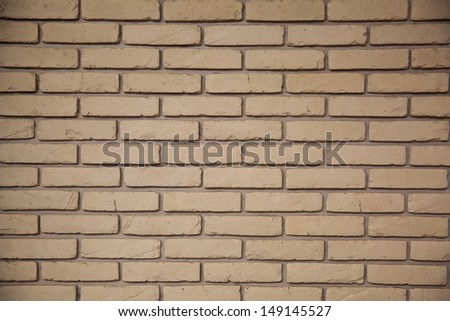Close up photo of a gray brick wall to use as a background pattern or texture.