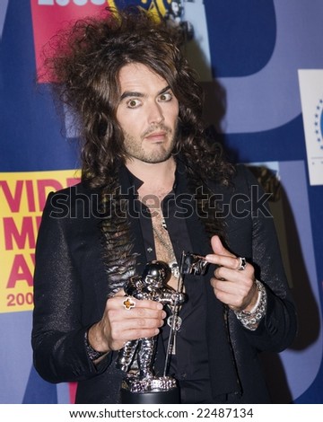 HOLLYWOOD, CA - SEPTEMBER 7: Host Russell Brand posing with a Moon Man award in the Press Room at the 2008 MTV Video Music Awards at Paramount Pictures Studio on September 7, 2008 in Hollywood, CA