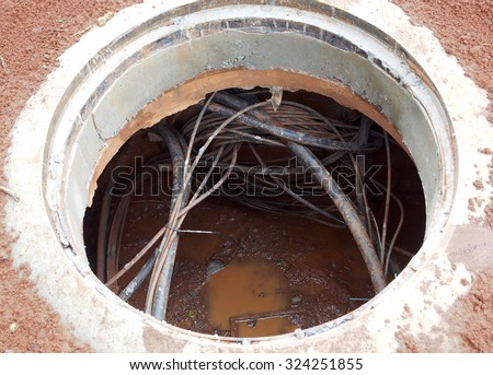 Underground cables with mud and water.