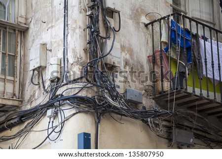 Chaos: External Electrical Wiring on a Street Corner by Street Sign (Cartagena, Spain)