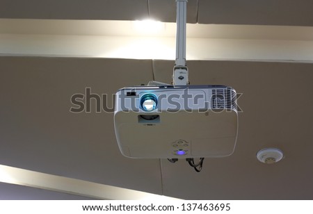 Overhead projector under the ceiling in boardroom