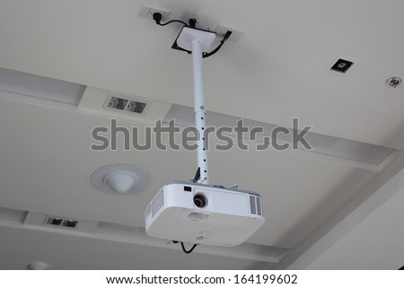 Projector hang on ceiling in meeting room