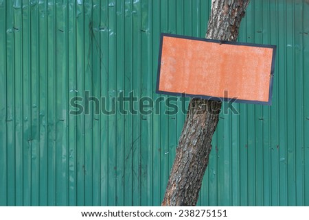 Orange Wood Signs background Green Zinc Fence