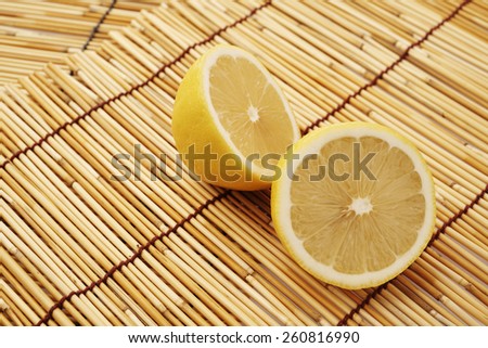 Lemons isolated on wooden background. Clipping Path