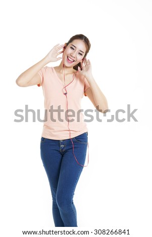 Enjoying Music On Smart Phone - This is a photo of a cute young woman ready to listen to some music on her ipod.