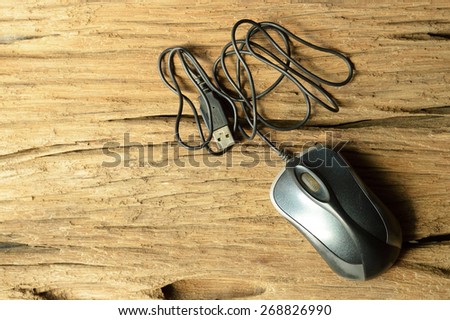 computer mouse on old wooden table