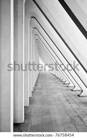 Modern tunnel in futuristic interior with concrete arches in perspective