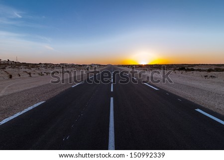 Desert sunset on the road