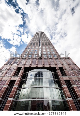 FRANKFURT, GERMANY - SEPTEMBER 28, 2013: Messeturm or Exhibition Tower, the headquarters of Goldman Sachs Germany and other global financial institutions in Frankfurt am Main. Wide angle photo