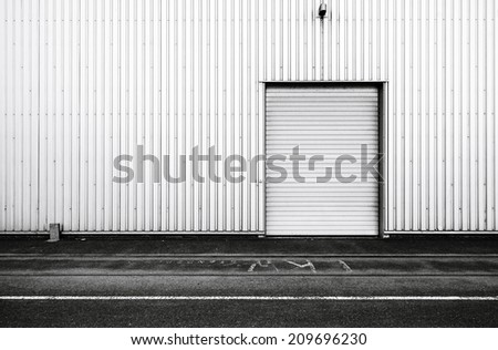 Simple steel wall with door at storage warehouse
