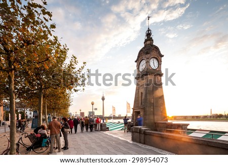 Rhine river promenade and boardwalk in Dusseldorf at sunset