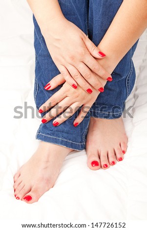 women\'s hands and feet on a white veil