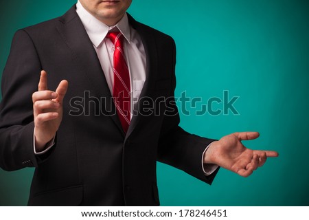 bright picture of businessman pointing direction on green background