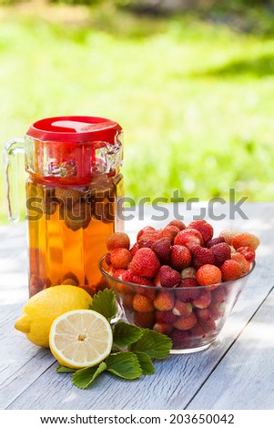 Fresh homemade strawberry lemonade with natural background. Summer.
