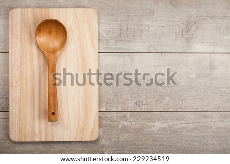 Wooden kitchen spoon on wood table